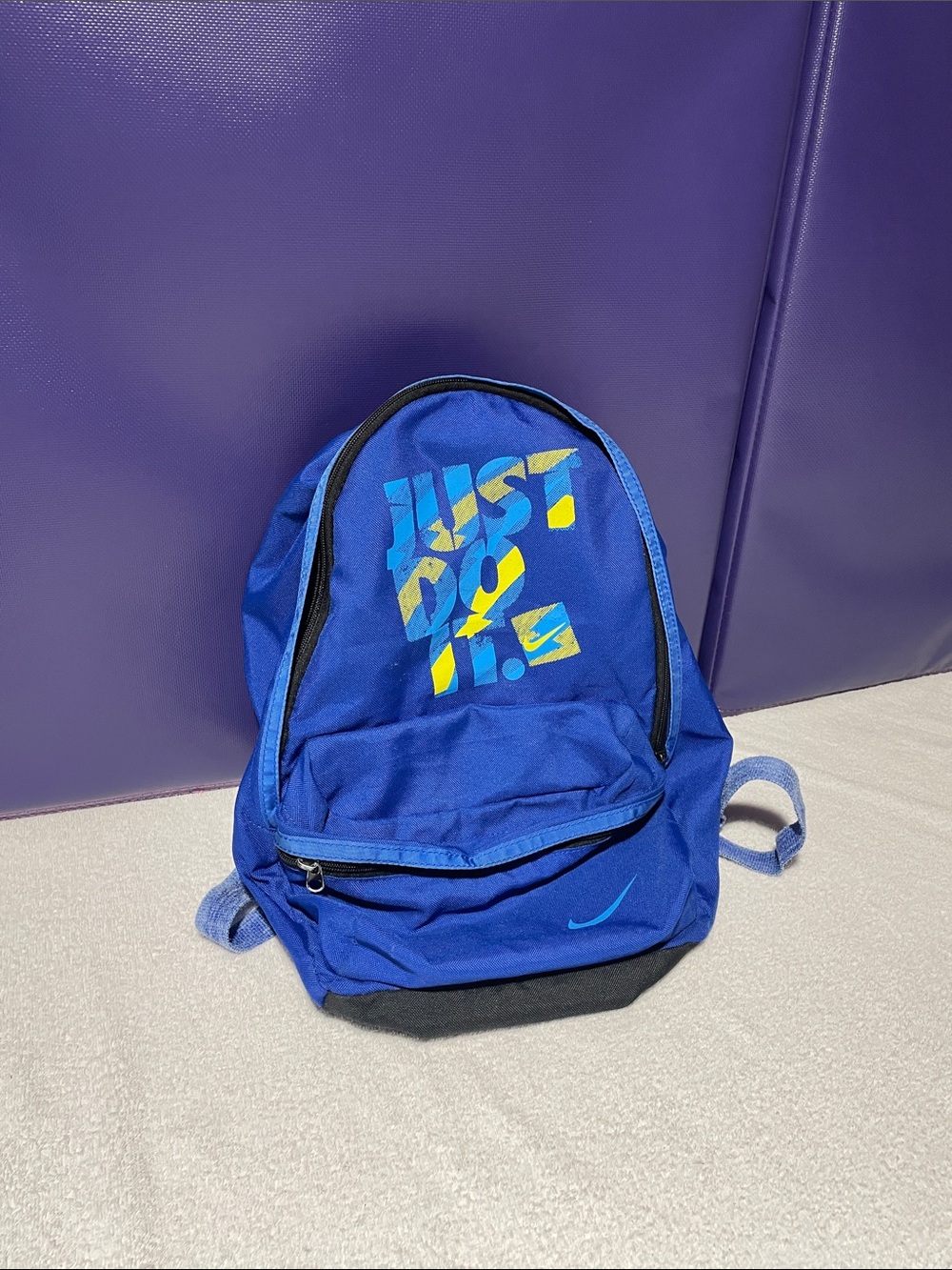 Nike Blue Backpack with Yellow Graphic Accents